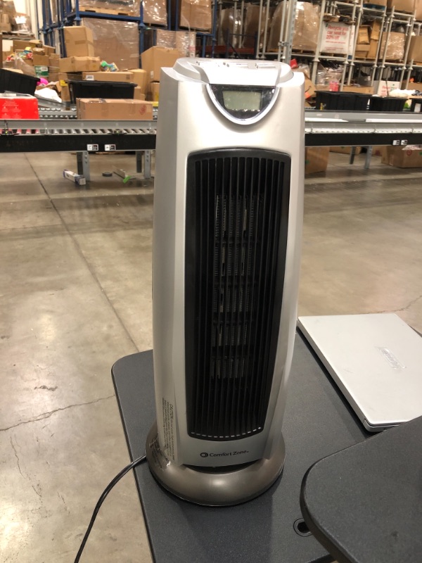 Photo 3 of **NONFUNCTIONAL**
Comfort Zone Oscillating Ceramic Tower Heater CZ499R
