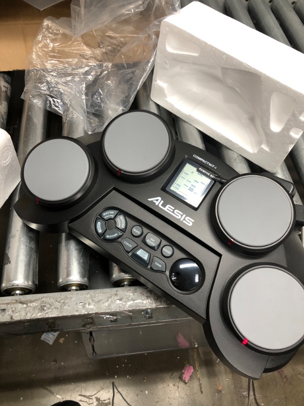 Photo 2 of Alesis Compact Kit 4 – Tabletop Electric Drum Set with 70 Electronic / Acoustic Drum Kit Sounds, 4 Pads, Battery- or Ac-power and Drum Sticks Included