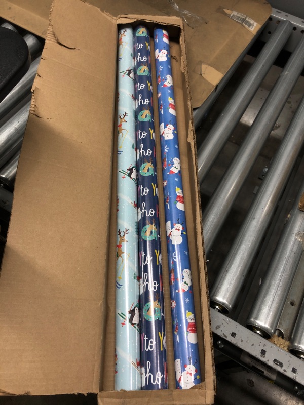 Photo 2 of Hallmark Cute Reversible Christmas Wrapping Paper for Kids (3 Rolls: 120 sq. ft. ttl) Penguins, Santa, Trees, Stripes, Snowflakes, "Merry Christmas" Family Christmas Wrapping Paper