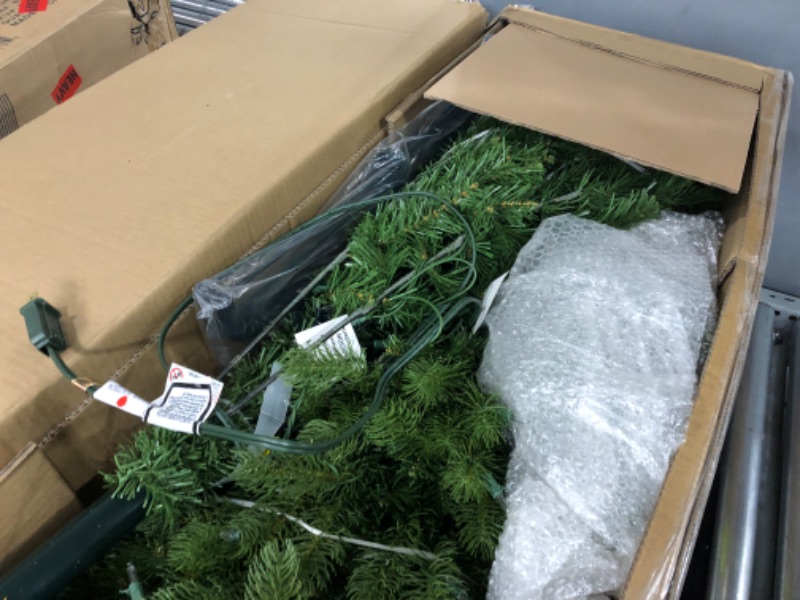 Photo 4 of **USED ITEM**
National Tree Company Pre-Lit 'Feel Real' Artificial Full Downswept Christmas Tree, Green, Douglas Fir, White Lights, Includes Stand, 6.5 feet 6.5 ft