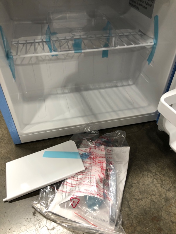 Photo 4 of ***NOT TESTED/MINOR DAMAGE***Frigidaire EFR176-BLUE 1.6 cu ft Blue Retro Fridge with Side Bottle Opener. for The Office, Dorm Room or Cabin