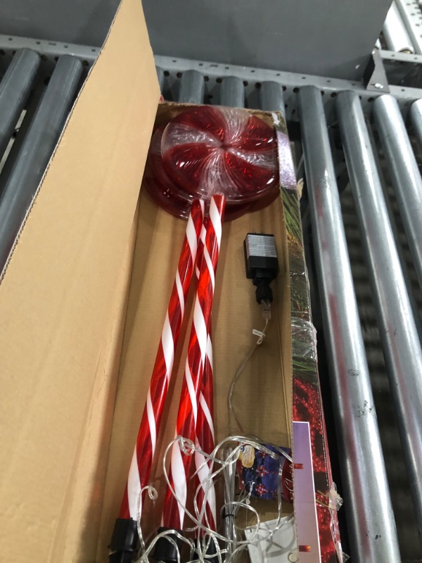 Photo 2 of **USED-ITEM**
Alpine Corporation 28" H Outdoor Candy Cane Yard Stakes with Red and White LED Lights (Set of 3)