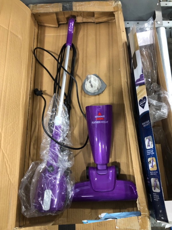 Photo 3 of **USED-ITEM**
Bissell Featherweight Stick Lightweight Bagless Vacuum with Crevice Tool, 20334, Purple