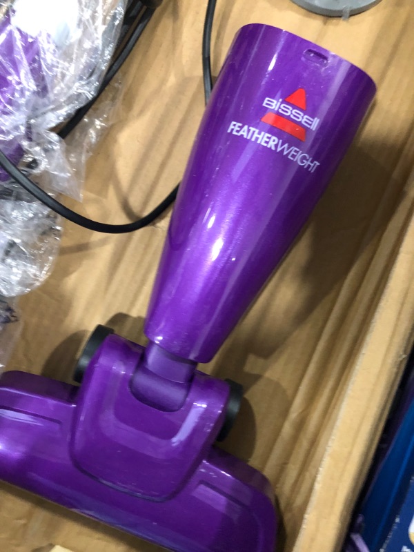 Photo 2 of **USED-ITEM**
Bissell Featherweight Stick Lightweight Bagless Vacuum with Crevice Tool, 20334, Purple
