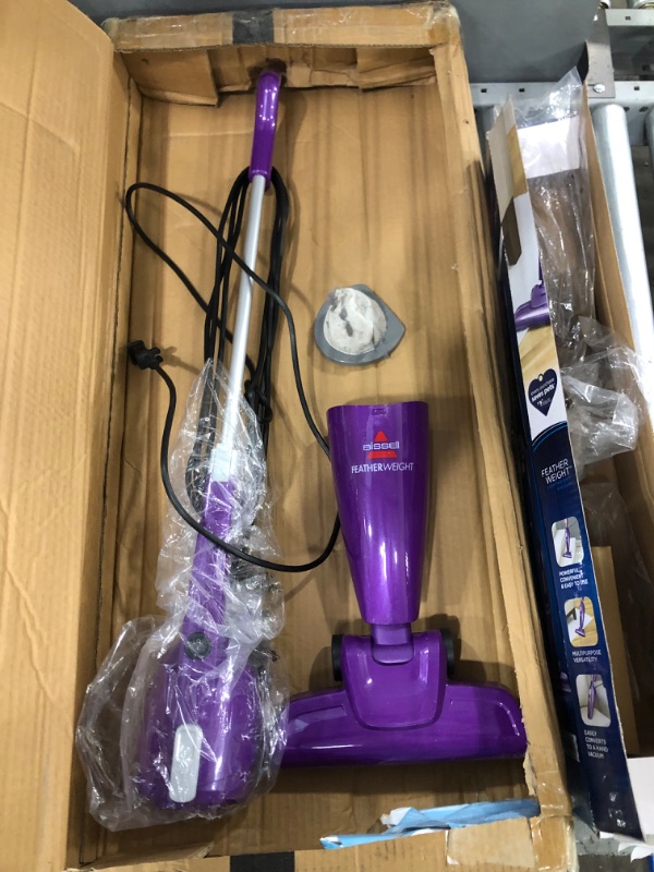 Photo 4 of **USED-ITEM**
Bissell Featherweight Stick Lightweight Bagless Vacuum with Crevice Tool, 20334, Purple