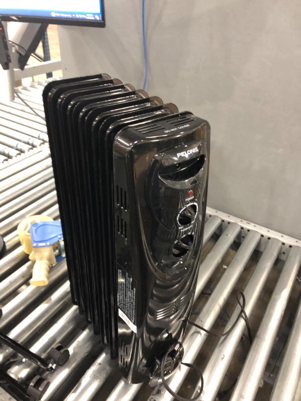 Photo 1 of **not functional, parts only**
PELONIS PHO15A2AGB, Basic Electric Oil Filled Radiator,black space heater, 26.10 x 14.20 x 11.00