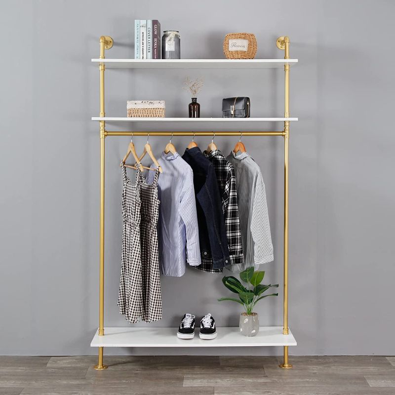 Photo 1 of EDCB Industrial Pipe Gold Clothing Rack with Shelves, Retail Display Wall Mounted Storage Clothes Hanging Shelf Gold Pipeline Hanging Rod Steampunk Style, 3 Tier Wood Garment Rack 80x42.7inch
