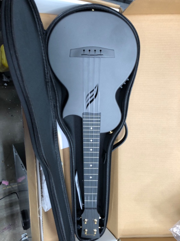 Photo 4 of Enya Tenor Ukulele 26 Inch Carbon Fiber Cutaway Travel Ukelele for Adult with Beginner Bundle Kit Including Online Video Lessons, Case, Strap, Capo and Strings?Nova U Pro Black?
