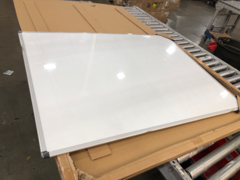 Photo 2 of DENTED FRAME**Amazon Basics Magnetic Dry Erase White Board, 35 x 47-Inch Whiteboard - Silver Aluminum Frame 35" x 47" Magnetic, Aluminum Frame