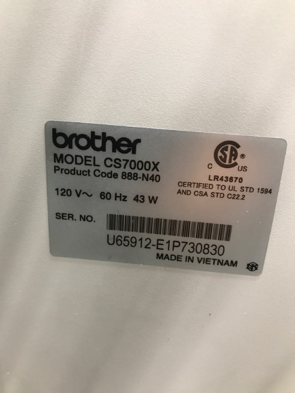 Photo 2 of *Powers On* Brother CS7000X Computerized Sewing and Quilting Machine, 70 Built-in Stitches, LCD Display, Wide Table, 10 Included Feet, White CS7000X Machine