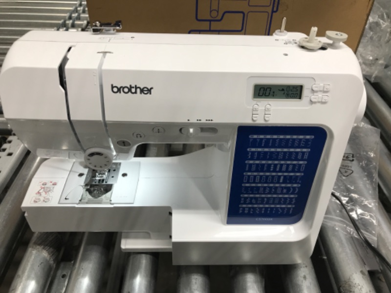 Photo 3 of *Powers On* Brother CS7000X Computerized Sewing and Quilting Machine, 70 Built-in Stitches, LCD Display, Wide Table, 10 Included Feet, White CS7000X Machine