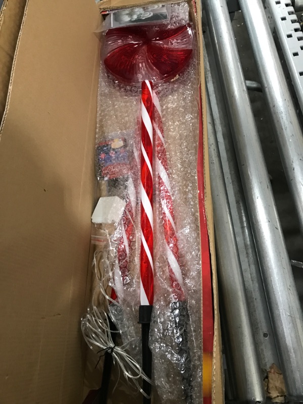 Photo 2 of Alpine Corporation 28" H Outdoor Candy Cane Yard Stakes with Red and White LED Lights (Set of 3)