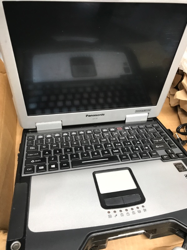 Photo 3 of tested: works
has scratches 
Panasonic Toughbook CF-31, i5 3rd Gen, 13.1-inch XGA Touchscreen, 8GB, 240GB SSD, Windows 10 Pro, WiFi, Bluetooth, GPS, DVD Multi Drive, 4G LTE (Renewed) 8 GB | 240 SSD | GPS, DVD, 4G LTE