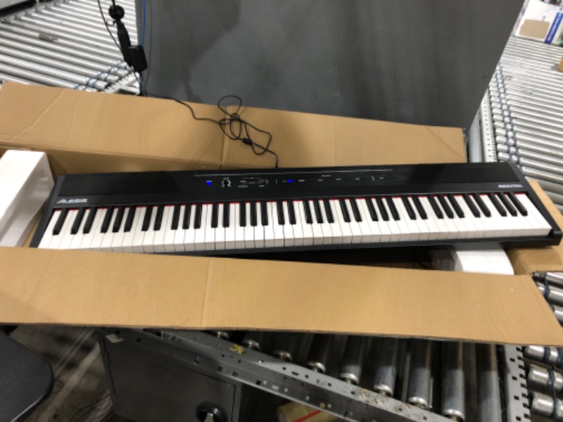 Photo 2 of Alesis Recital – 88 Key Digital Piano Keyboard with Semi Weighted Keys, 2x20W Speakers, 5 Voices, Split, Layer and Lesson Mode, FX and Piano Lessons Recital Piano Only