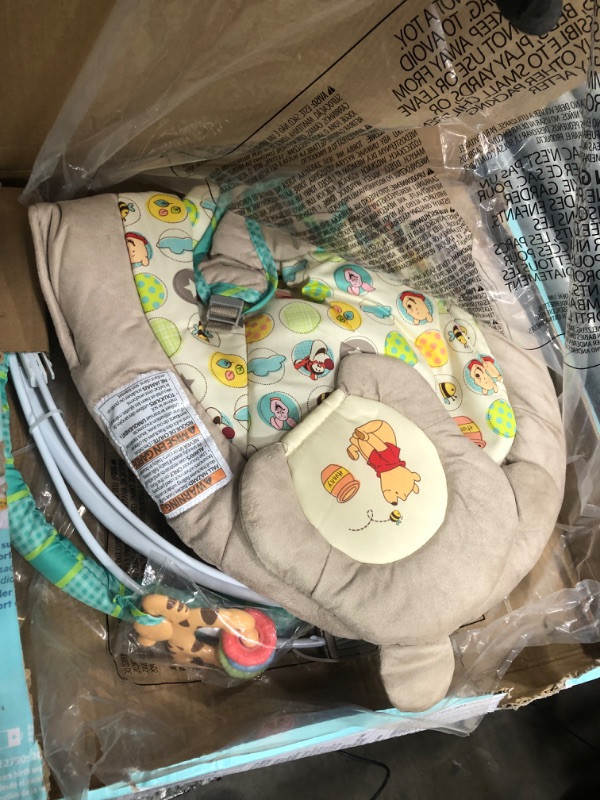 Photo 2 of Bright Starts Winnie the Pooh Dots & Hunny Pots Baby Bouncer with Vibrating Infant Seat, Music & 3 Playtime Toys, 23x19x23 Inch
