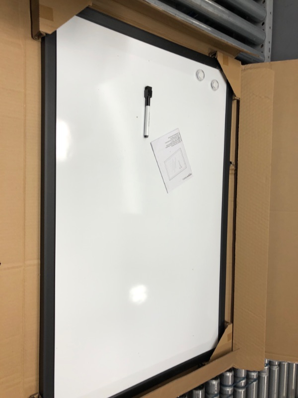 Photo 2 of Amazon Basics Magnetic Dry Erase White Board, 35 x 23-Inch Whiteboard - Black Wooden Frame 23"x35" Magnetic, Wood Frame