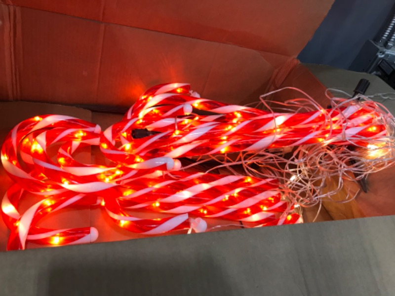 Photo 2 of 24.5" Candy Cane Lights with Stakes, 12 Packs Large Christmas Pathway Lights Outdoor, 8 Light Modes Candy Cane Pathway Markers Christmas Decorations for Yard Patio Garden Walkway Sidewalks