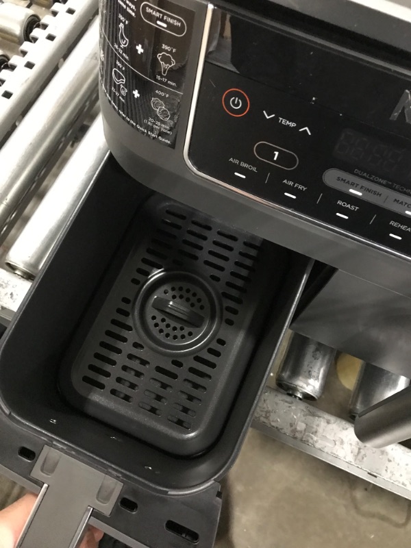 Photo 6 of **used item**
Ninja DZ201 Foodi 8 Quart 6-in-1 DualZone 2-Basket Air Fryer with 2 Independent Frying Baskets, Match Cook & Smart Finish to Roast, Broil, Dehydrate & More for Quick, Easy Meals, Grey