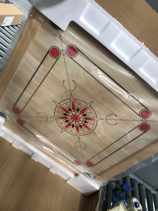 Photo 4 of Carrom Board Game - Wooden Strike and Pocket Game Set with Group of Black and Beige Coins, 2 Red Queen Coins, Striker Coin, and Cue Sticks by Hey Play