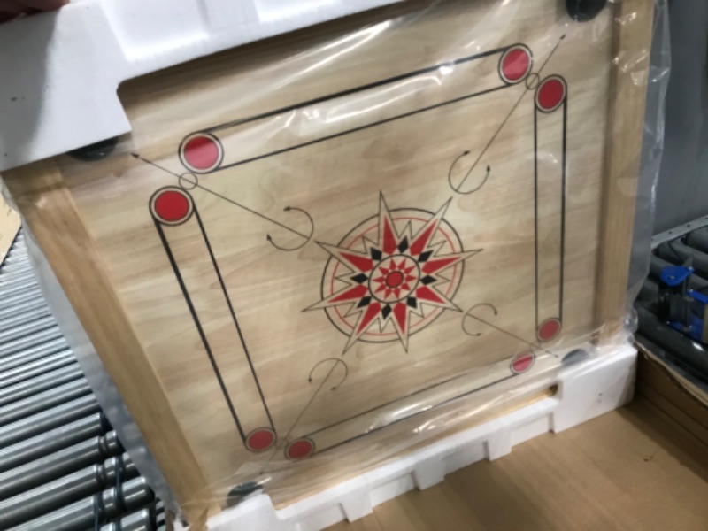 Photo 2 of Carrom Board Game - Wooden Strike and Pocket Game Set with Group of Black and Beige Coins, 2 Red Queen Coins, Striker Coin, and Cue Sticks by Hey Play