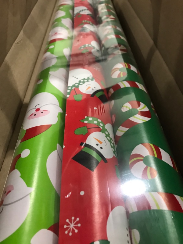 Photo 1 of American Greetings Reversible Christmas Extra-Wide Wrapping Paper Bundle, Santa, Snowmen and Candy Canes (3 Rolls, 120 sq. ft.)