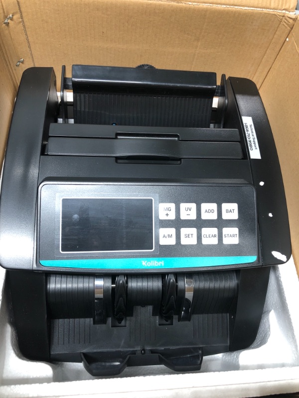 Photo 4 of Kolibri Money Counter Machine - 1,500 bills per min, advanced counterfeit detection, set up in minutes, Add and Batch Modes, Cash Counter with LCD Display 1012375768
026715267330
Size: 9” x 11” x 5” 