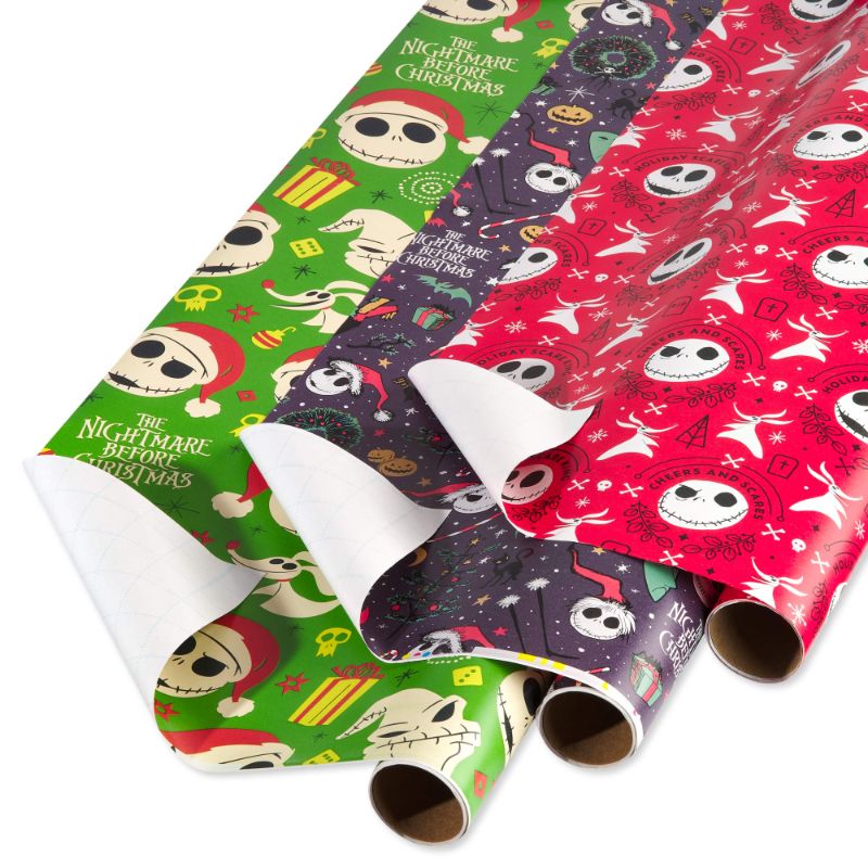 Photo 1 of American Greetings Nightmare Before Christmas Wrapping Paper Bundle with Cut Lines, Jack Skellington and Zero (3 Rolls, 105 sq. ft.)
