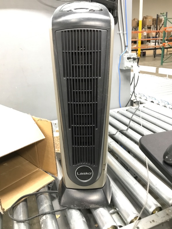 Photo 4 of * has remote******
***** Tested/ Works ******
Lasko Oscillating Ceramic Tower Space Heater for Home with Adjustable Thermostat, Timer and Remote Control, 22.5 Inches, Grey/Black, 1500W, 751320