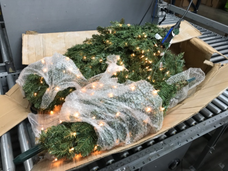 Photo 1 of Puleo International 7.5 Foot Pre-Lit Fraser Fir Pencil Artificial Christmas Tree with 350 UL Listed Clear Lights, Green
