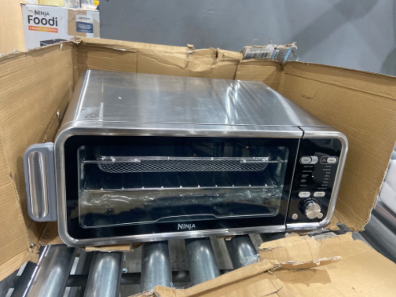 Photo 2 of *SEE COMMENTS*- Ninja SP301 Dual Heat Air Fry Countertop 13-in-1 Oven with Extended Height, XL Capacity, Flip Up & Away Capability for Storage Space, with Air Fry Basket, SearPlate, Wire Rack & Crumb Tray, Silver

