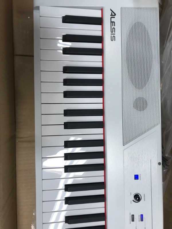 Photo 4 of Alesis Recital – 88 Key Digital Piano Keyboard with Semi Weighted Keys, 5 Voices, Piano Lessons, M-Audio Sustain Pedal and HDH40 Piano Headphones Recital White Piano + Sustain Pedal + Headphones