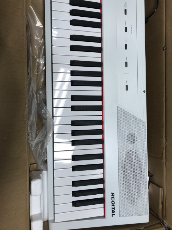 Photo 5 of Alesis Recital – 88 Key Digital Piano Keyboard with Semi Weighted Keys, 5 Voices, Piano Lessons, M-Audio Sustain Pedal and HDH40 Piano Headphones Recital White Piano + Sustain Pedal + Headphones