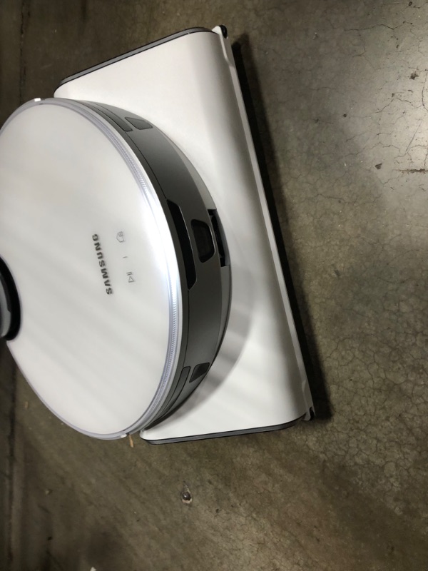 Photo 3 of **CHARGED , TESTED , AND FUNCTIONAL***
SAMSUNG Jet Bot AI+ Robot Vacuum Cleaner w/ Object Recognition, Intelligent Cleaning, Clean Station, 5-Layer Filter, Touchless Dust Removal for Hardwood Floors, Carpets, VR50T95735W, White