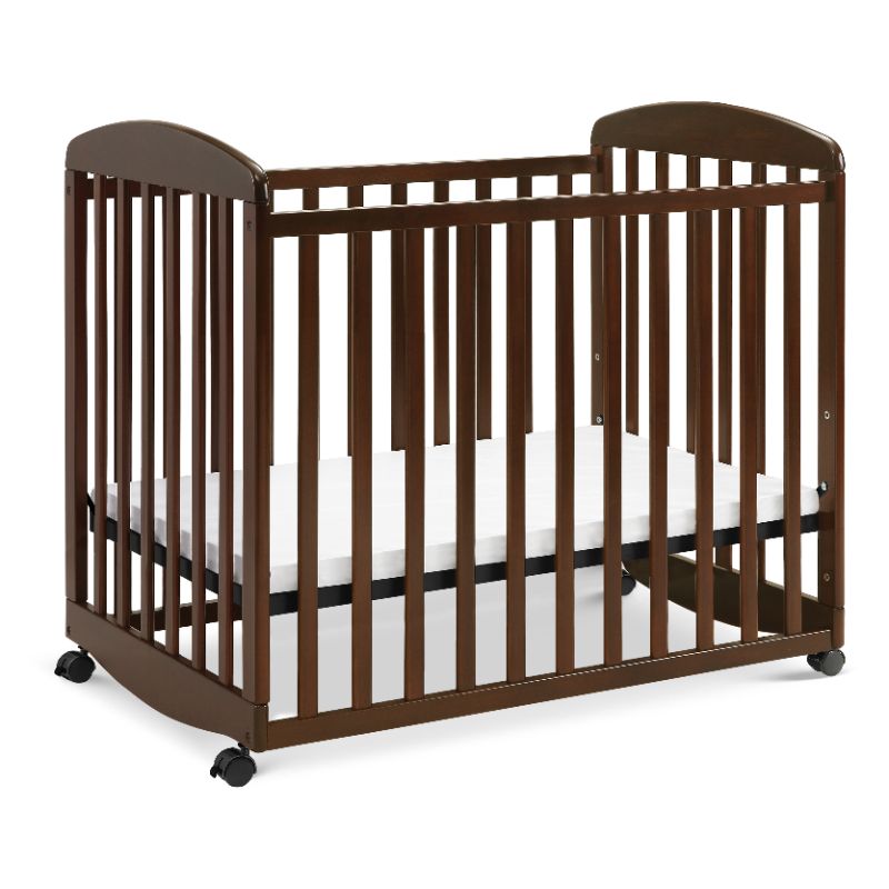 Photo 1 of Davinci Alpha Mini Rocking Crib in Espresso with Complete Slumber Mini Crib Mattress Espresso Crib.