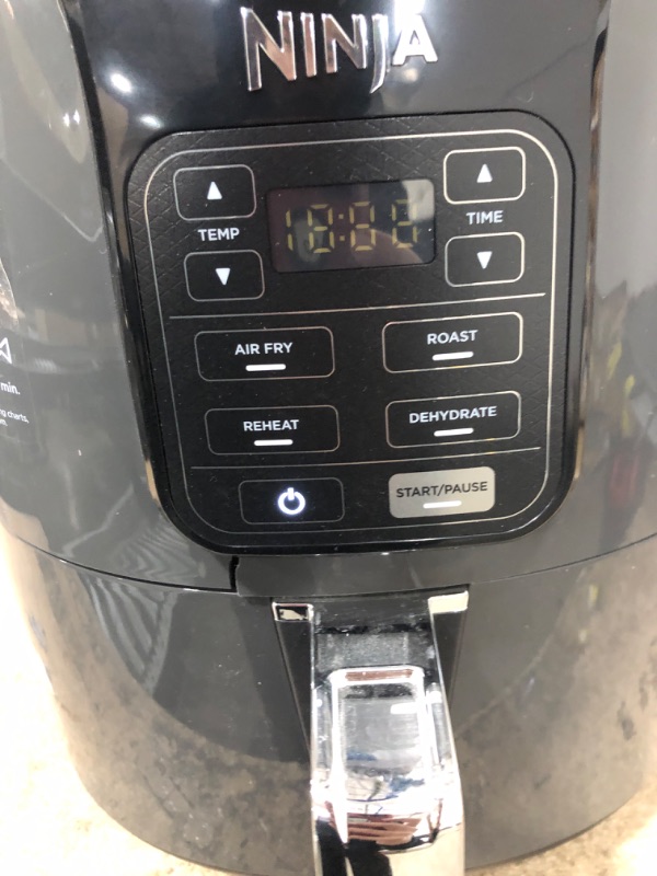 Photo 3 of *** NEW *** **** SHIPPING DAMAGE ON THE SIDE ****
Ninja AF101 Air Fryer that Crisps, Roasts, Reheats, & Dehydrates, for Quick, Easy Meals, 4 Quart Capacity, & High Gloss Finish, Black/Grey 4 Quarts