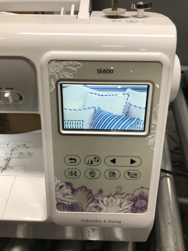 Photo 5 of *** TESTED** POWERS ON** Brother SE600 Sewing and Embroidery Machine, 80 Designs, 103 Built-In Stitches, Computerized, 4" x 4" Hoop Area, 3.2" LCD Touchscreen Display, 7 Included Feet