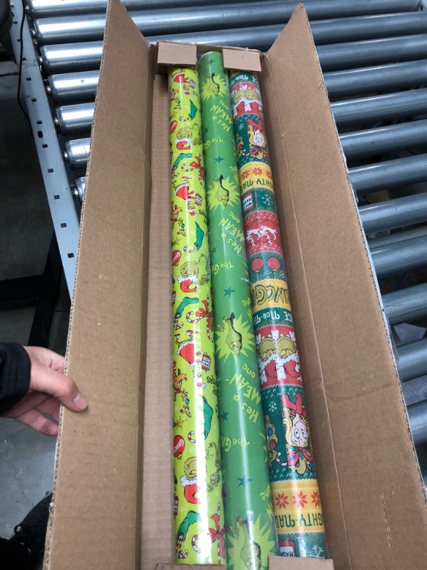 Photo 2 of American Greetings Christmas Wrapping Paper with Cut Lines Bundle, The Grinch (3 Rolls, 105 sq. ft.)