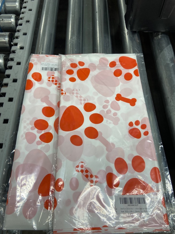 Photo 2 of 2 of-  Paw Print Tablecloth, 1 Pack Large Size Plastic 54"x108" Dog Paw Print and Bone Sign Tablecloths, Cute Table Cover for Kids Boy Girl Dog Birthday Party Supplies- Orange