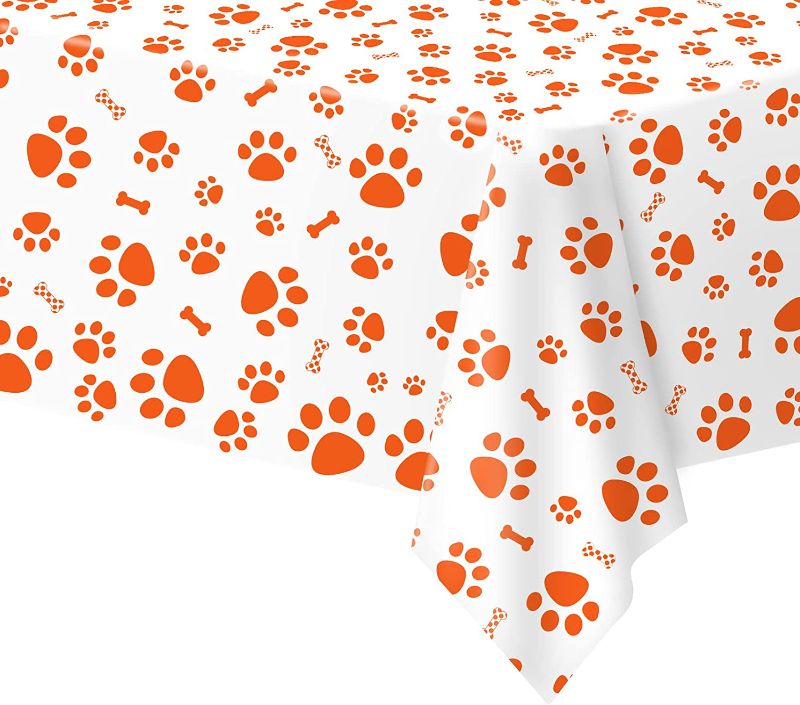 Photo 1 of 2 of-  Paw Print Tablecloth, 1 Pack Large Size Plastic 54"x108" Dog Paw Print and Bone Sign Tablecloths, Cute Table Cover for Kids Boy Girl Dog Birthday Party Supplies- Orange