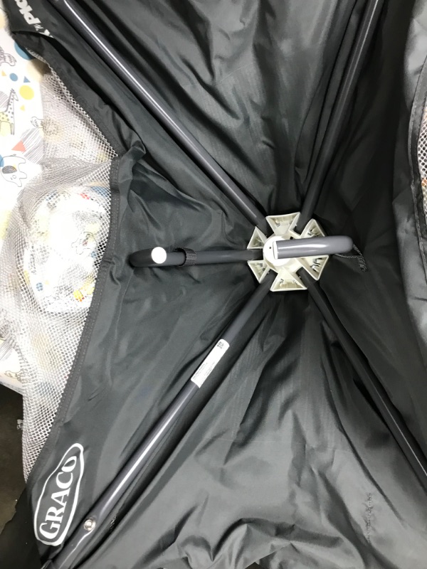 Photo 1 of Graco Pack and Play Portable Playard, Push Button Compact Fold, Carnival Portable Playard Carnival