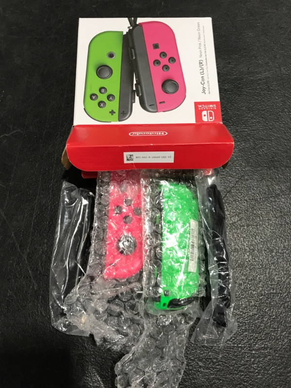 Photo 2 of Nintendo Joy-Con (L)/(R) - Neon Pink / Neon Green for Nintendo Switch
