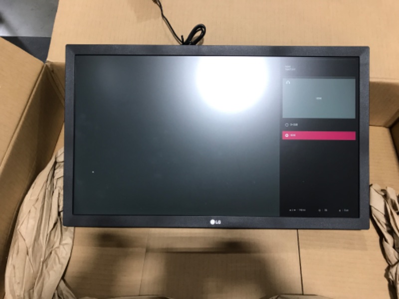 Photo 2 of Lg Consumer - 27" 1920x1080 Fhd Ips (2537642). OPEN BOX. MISSING REMOTE CONTROL. PRIOR USE. POWERS ON/FUNCTIONING. STICKER RESIDUE ON BACK. 
