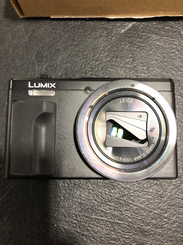 Photo 4 of Panasonic Lumix DMC-ZS60 Digital Camera (Black). PRIOR USE. SHUT STUCK OPEN. MISSING ACCESSORIES. NEEDS CHARGED, UNTESTED. 
