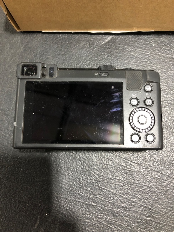 Photo 5 of Panasonic Lumix DMC-ZS60 Digital Camera (Black). PRIOR USE. SHUT STUCK OPEN. MISSING ACCESSORIES. NEEDS CHARGED, UNTESTED. 
