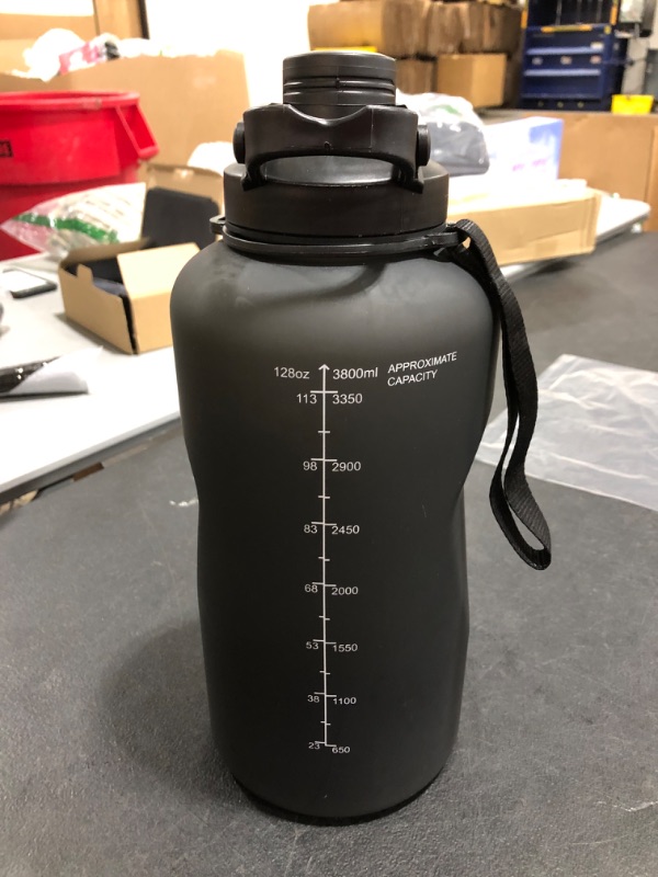 Photo 2 of 1 GALLON WATER BOTTLE. BLACK. PRIOR USE. 