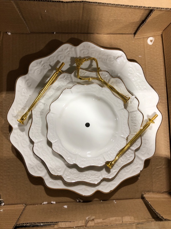 Photo 1 of 3 Decorative white plates with gold color trim and a hole in the middle.