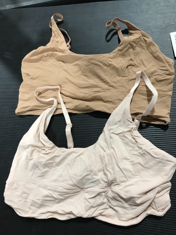 Photo 1 of 2 pack tan and creme sport bras size M 