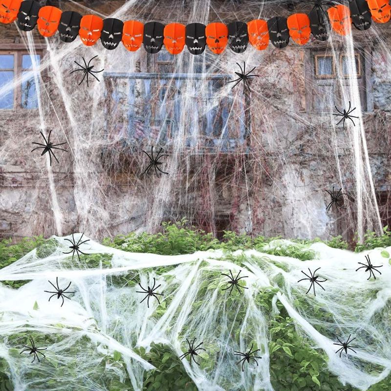 Photo 1 of BigOtters 1000sqft Fake Spider Web, Halloween Cobweb Decor Stretchy Spider Web with Ghost Banner for Halloween Spider Web Outdoor, 60 Fake Spiders
