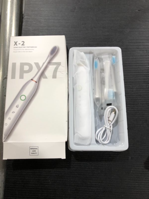 Photo 2 of Electric Toothbrush, IPX7 Sonic Electric Toothbrush for Adults & Kids, USB Rechargeable Travel Toothbrush with 5 Modes & 2 Replacement Heads & Long Stand-By Time?White?