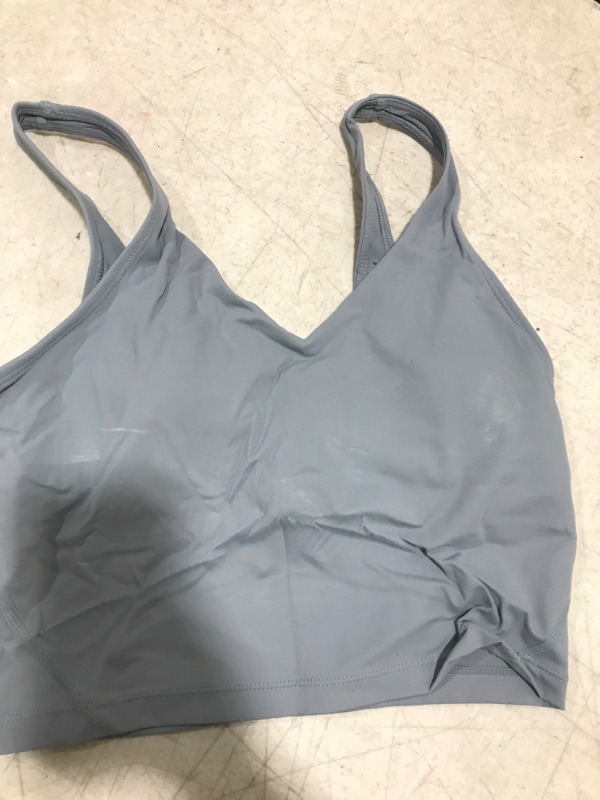 Photo 1 of workout tank with padding size small ** has white marks on the front **